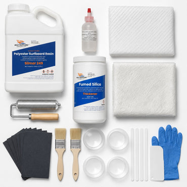 Boat fiberglass repair kit contents: gallon of Silmar 249 polyester resin with MEKP hardener, 1708 biaxial fiberglass, chopped strand mat, fumed silica, laminating roller, sandpaper, brushes, mixing cups, sticks, spreader and gloves
