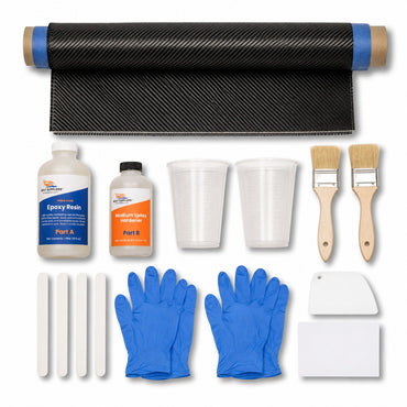 Carbon fiber skinning kit contents: 12 inch by 5 foot 2x2 twill carbon fiber strip with taped edges, Boat Suppliers two-part epoxy resin and hardener, mixing cups, chip brushes, mixing sticks, spreader and nitrile gloves