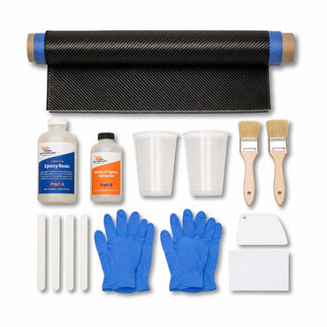 Carbon fiber skinning kit contents: 12 inch by 5 foot 2x2 twill carbon fiber strip with taped edges, Boat Suppliers two-part epoxy resin and hardener, mixing cups, chip brushes, mixing sticks, spreader and nitrile gloves