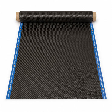 12 inch by 5 foot strip of 5.7oz 3K 2x2 twill carbon fiber unrolled from a kraft tube, both long cut edges sealed with Boat Suppliers branded blue cut tape printed with the logo and boatsuppliers.com