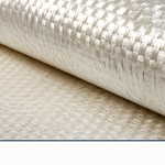 A roll of woven roving fiberglass fabric on a workbench