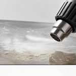 A heat gun releasing trapped air bubbles from a clear epoxy resin surface