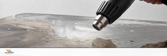 A heat gun releasing trapped air bubbles from a clear epoxy resin surface
