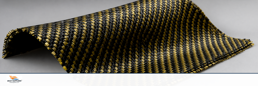 Carbon kevlar hybrid fabric showing interwoven black carbon and gold aramid threads
