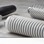 Fiberglass laminating rollers including a finned aluminum bubble roller and paddle roller