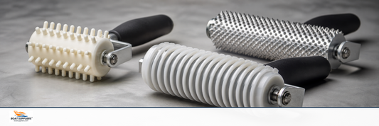 Fiberglass laminating rollers including a finned aluminum bubble roller and paddle roller