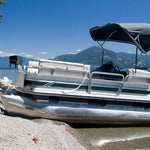 Aluminum pontoon boat beached on a gravel shoreline by a lake, cover for a guide to filling pontoons with pour foam.