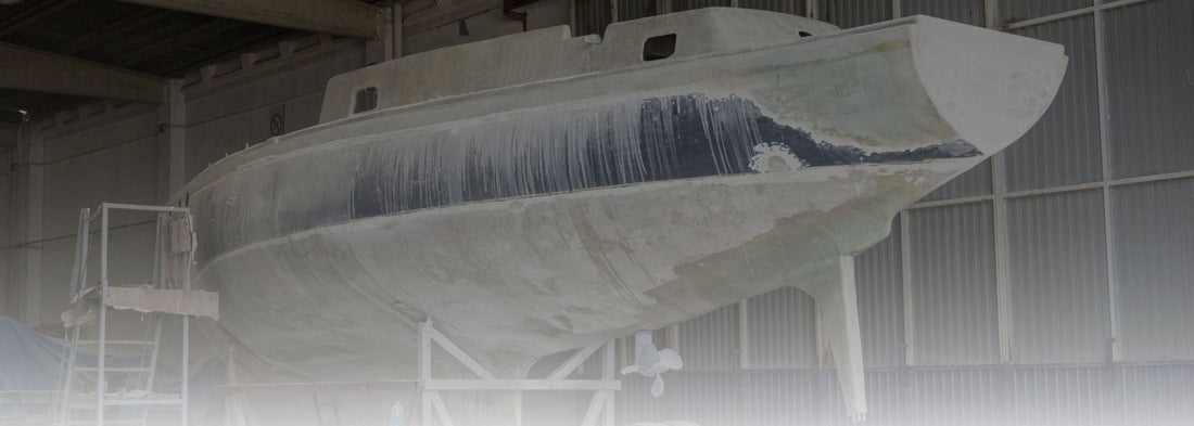 Fiberglass cloth being applied to a boat hull