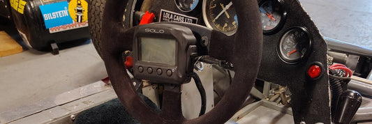 Custom poured urethane foam race seat covered in fleece in a vintage Lola T342 Formula Ford cockpit
