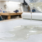 Resin being applied to fiberglass cloth - comparing polyester vinyl ester and epoxy resins