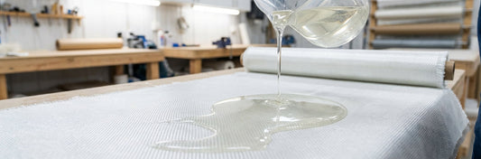 Resin being applied to fiberglass cloth - comparing polyester vinyl ester and epoxy resins