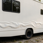 Long wavy delamination ripple along the fiberglass sidewall of a motorhome