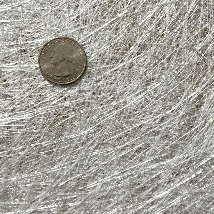 Fiberglass chopped strand mat with quarter for scale, fiberglass and carbon laminating materials
