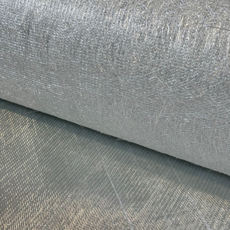 Rolled biaxial fiberglass cloth showing stitched fabric and chopped strand mat backing