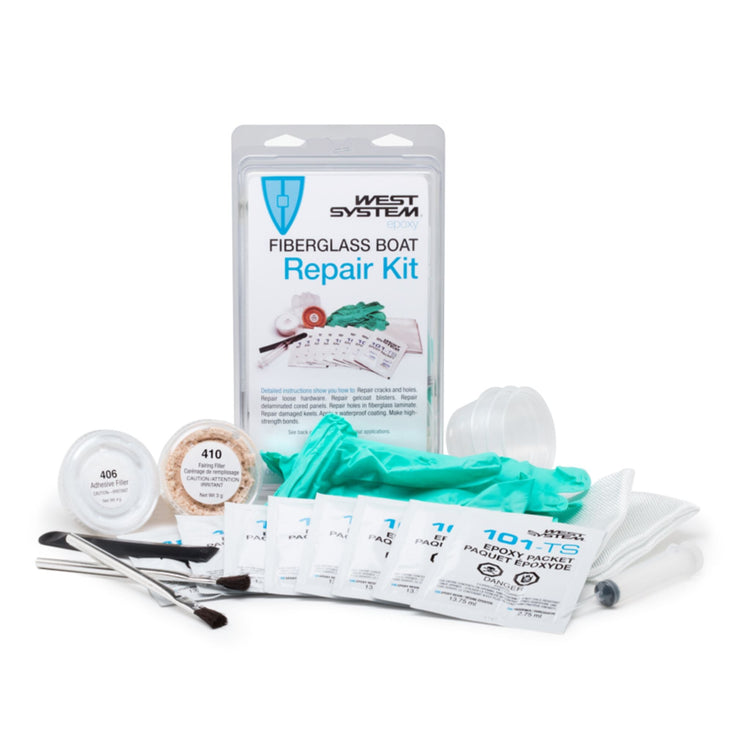 West System fiberglass boat repair kit with epoxy packets, fillers, cloth and gloves