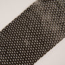 11 oz unidirectional carbon fiber tape laid flat on a diagonal, full tape width visible with both finished edges and white cross threads