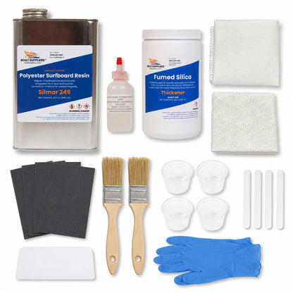 Complete fiberglass repair kit contents: quart of Boat Suppliers Silmar 249 polyester resin with MEKP hardener, fiberglass cloth, chopped strand mat, fumed silica, sandpaper, brushes, mixing cups, sticks, spreader and gloves