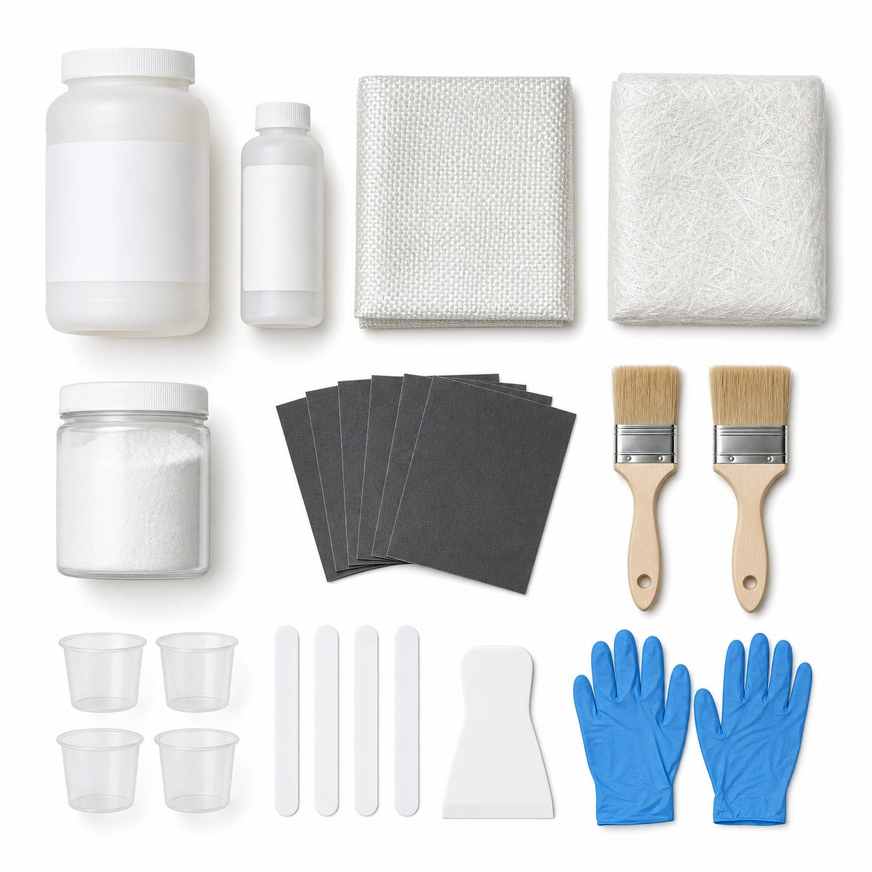 Fiberglass repair kit flat lay showing resin, hardener, woven cloth, mat, filler and application tools
