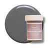 Gunsmoke Grey liquid pigment 1 oz jar beside a grey cured color swatch