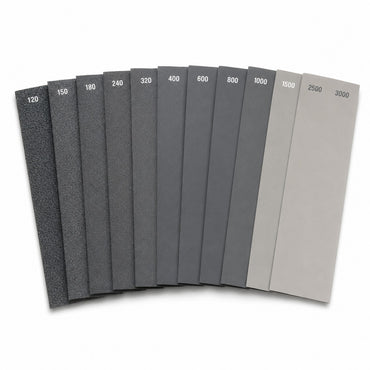 Complete wet dry sandpaper set, twelve sheets fanned showing 120 to 3000 grit