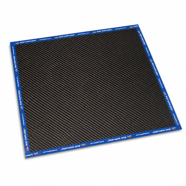 Single 12 inch by 12 inch square of 5.7oz 3K 2x2 twill carbon fiber lying flat, all four edges sealed with Boat Suppliers branded blue cut tape