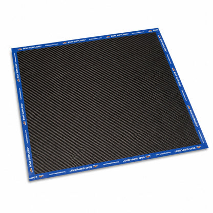 Single 12 inch by 12 inch square of 5.7oz 3K 2x2 twill carbon fiber lying flat, all four edges sealed with Boat Suppliers branded blue cut tape