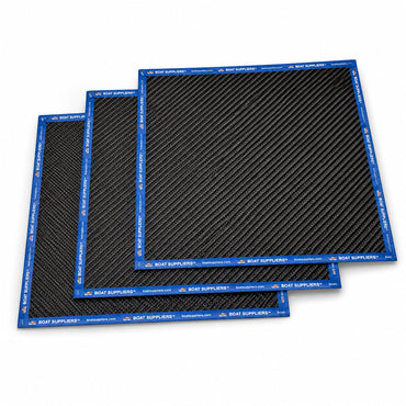 Three 12 inch by 12 inch squares of 5.7oz 3K 2x2 twill carbon fiber fanned in a cascade, every edge sealed with Boat Suppliers branded blue cut tape