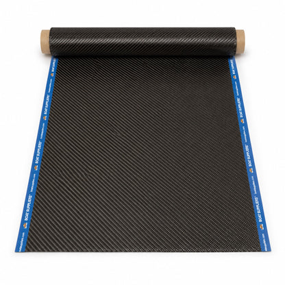 12 inch by 5 foot strip of 5.7oz 3K 2x2 twill carbon fiber unrolled from a kraft tube, both long cut edges sealed with Boat Suppliers branded blue cut tape printed with the logo and boatsuppliers.com