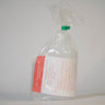 Real photo: dispenser bottle as shipped in bag with Bodi adjustable volume dispenser directions