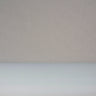 Close-up of peel ply release fabric, the fine woven texture of the cloth above the smooth rounded edge of the roll below