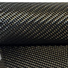 19.7 oz 2x2 twill carbon fiber on the roll with a length draped below, the heavy 12K weave catching the light across both layers