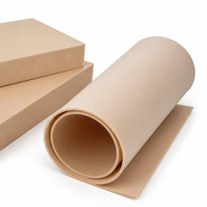 Thin plain PVC foam core sheet loosely rolled beside thicker rigid plain foam panels.
