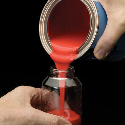 Pouring paint from a quart can into the Preval graduated glass jar