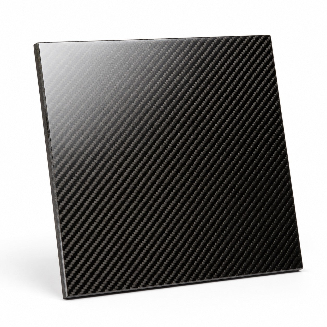 Rigid glossy laminated carbon fiber panel laid up from 2x2 twill fabric